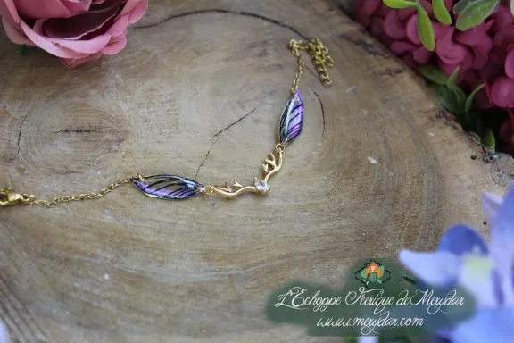 Bracelet dore avec ailes bleu violet doubles sur ramure et cristal, variante