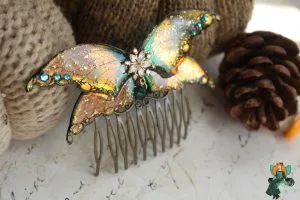 Peigne a cheveux aile de chauve-souris doree orange avec breloque fleur