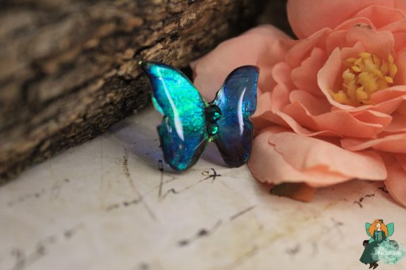 Broche papillon turquoise bleu